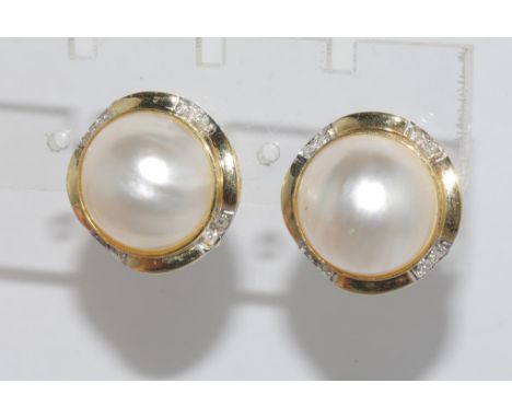 Yellow gold, mabe pearl & diamond earrings marked 14K, with post and clip fittings, weight: approx 6.83 grams