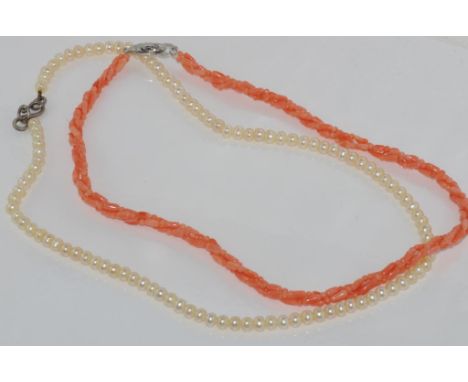 Two necklaces (pearl and coral) both with silver clasps