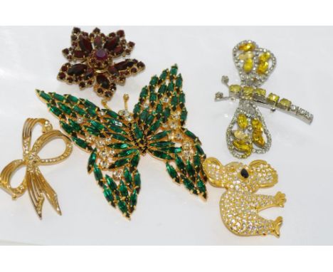 Two rhinestone brooches (Koala and bow) with a large green butterfly brooch (possibly  Swarovski) and a dragonfly brooch