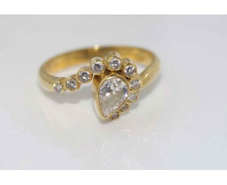 18ct yellow gold and multi-diamond ring with tear-drop centre diamond and a sweep of graduating channel set diamonds surround