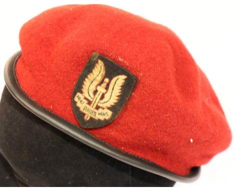 A post war SAS red beret, badged, medium size. P&amp;P Group 1 (£14+VAT for the first lot and £1+VAT for subsequent lots) 