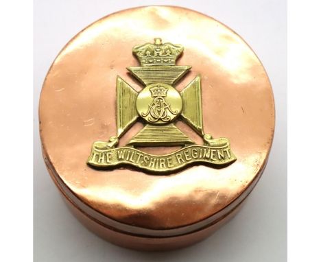 Trench Art; a WWI Wiltshire Regiment badge on a heavy copper pot, D: 70 mm . P&amp;P Group 1 (£14+VAT for the first lot and £