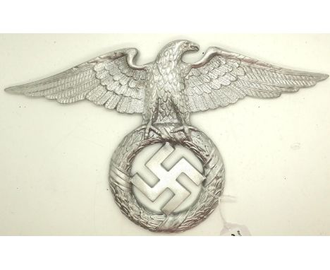 An early NSDAP copy cast and polished metal wall or door mounting eagle, wingspan: 35 cm. P&amp;P Group 2 (£18+VAT for the fi