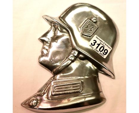 A polished metal SS soldiers side profile, wall or door mounting with threaded holes verso, H: 21 cm. P&amp;P Group 2 (£18+VA