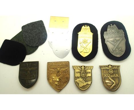 Six German WWII re-enactment metal arm shields including Stalingrad, Kuban, Krim, Narvik, Balkan, Denjansk. P&amp;P Group 1 (