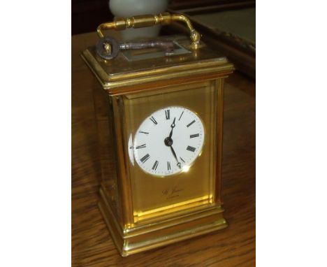 St James London brass carriage clock in bevelled edged glass case with visible escapement