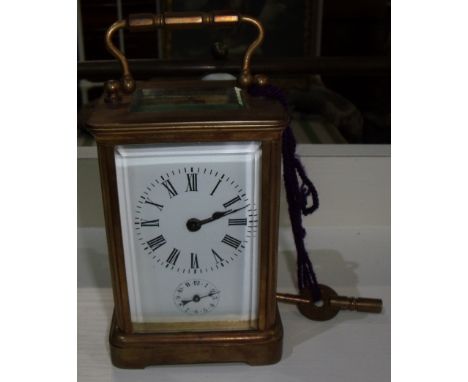 Early 20th C French brass cased carriage clock alarm with white enamel dial and subsidary alarm dial the movement stamped D H