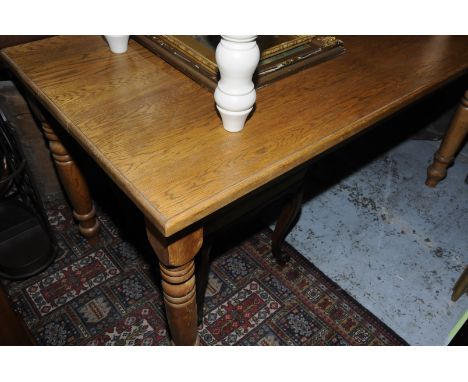 Light oak rectangular table on turned supports 