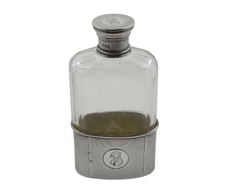 Early 20th century silver and faceted cut glass hip flask, removable engine turned silver cup and screw top lid, both with en