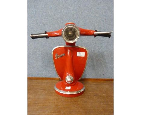 A red Vespa table lamp 