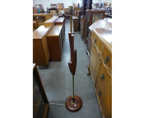 A teak standard lamp 