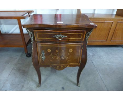 A French  floral marquetery inlaid mahogany and gilt metal mounted bombe shaped petit commode 