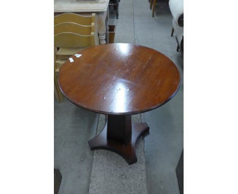 A mahogany circular lamp table 