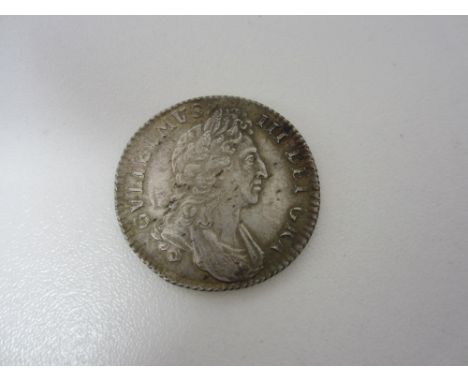 William III, 1694-1702,Shilling, 1697, first draped bust right, R.Crowned cruciform shields, edge milled (S.3497).  Stamp fro