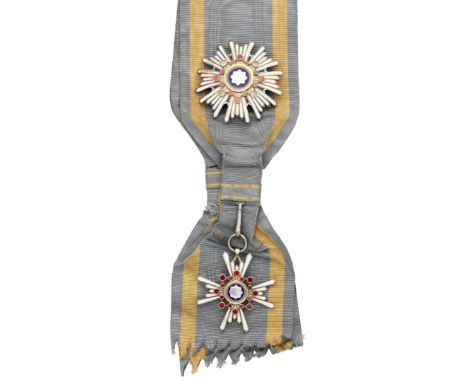 Japan,Order of the Sacred Treasure, first class set of insignia, comprising sash badge and breast star. In lacquered box of i