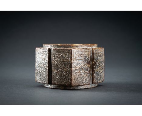 AN ARCHAISTIC BROWN JADE CONG WITH 'PHOENIXES', QINGChina, Qing Dynasty (1644-1912). Crafted in the style of the Liangzhu cul