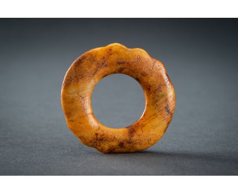 A SMALL ARCHAISTIC HONEY JADE DISC, QING DYNASTY OR EARLIERChina, Qing Dynasty (1644-1912) or earlier. Crafted in the style o