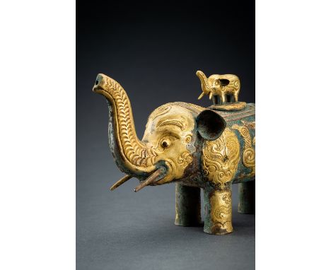 AN ARCHAISTIC FIRE-GILT COPPER REPOUSSÃ‰ VESSEL OF AN ELEPHANT WITH CUBChina, style of the Tang dynasty - dating to the late 