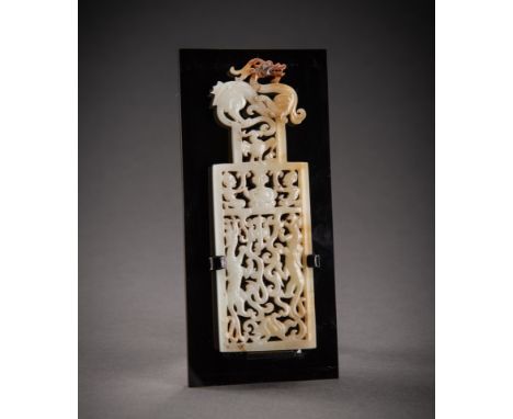 A FINE OPENWORK WHITE AND RUSSET JADE PLAQUE WITH THE ANIMALS OF THE FOUR DIRECTIONS, QINGChina, Qing Dynasty (1644-1912). Ma