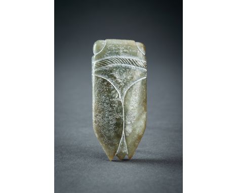 AN ARCHAISTIC GREEN JADE PENDANT OF A CICADAChina, 20th century. Executed in the style of the Hongshan culture, showcasing ma
