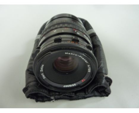 A HASSELBLAD 120MM F4 CFI CARL ZEISS MACRO PLANAR T* LENS, fitted with two lens caps and padded bag