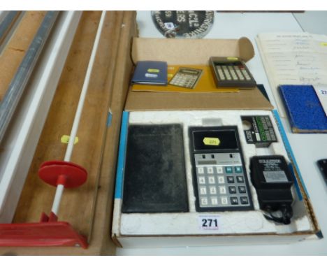 THREE POCKET CALCULATORS, a Lloyds Accumaric 200, A Sharpe 'Elsi Mate' EL8118 and a Sharp EL326E together with a Surveyor's s