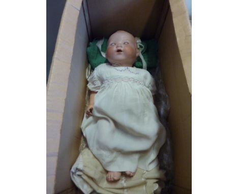 AN ARMAND MARSEILLE BISQUE HEAD BABY DOLL, nape of neck marked 'A.M. Germany. 351./8.K', slot to nape of neck, sleeping eyes,