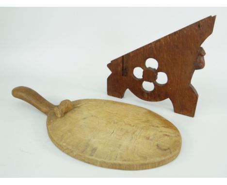 ROBERT THOMPSON MOUSEMAN CHEESE BOARD IN OAK, of oval form with elevated widening handle, carved mouse to the back of the boa