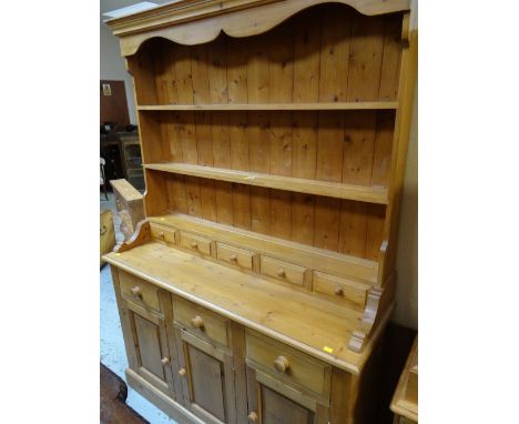 PINE DRESSER having open rack with spice drawers, cupboard and drawers to the base, 198cms h x 138cms w