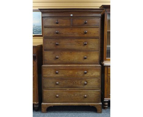 ANTIQUE OAK CHEST ON CHEST with eight drawers and turned knobs on bracket feet, 199cms h x 118cms w