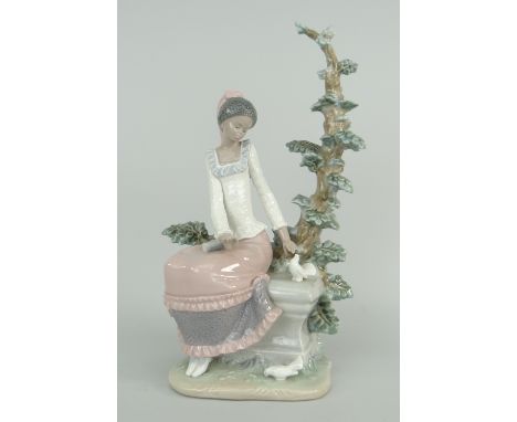 LLADRO MODEL OF AN AFRO-CARIBBEAN GIRL IN PINK DRESS seated against a fir tree with doves