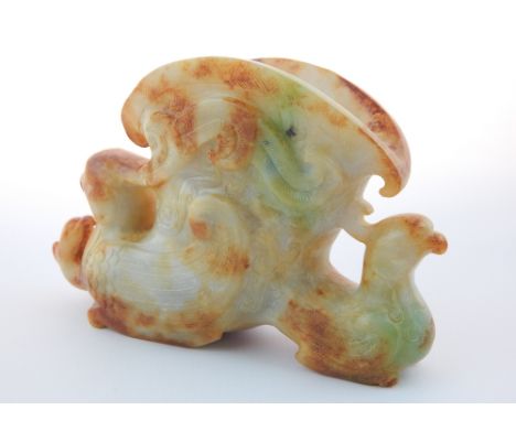 A Chinese jade rhyton cup, carved with three phoenixes 