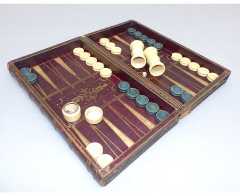 Late 19th century leather chess and backgammon board by Calvert of Fleet Street, in the form of two books and hinged to revea