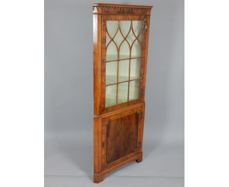 Reproduction yew standing corner cabinet, with glazed upper section on bracket feet, 180cm h