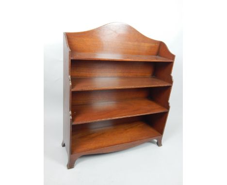 19th century mahogany open bookcase, of waterfall design with a serpentine back and arrangement of four shelves, on shaped br