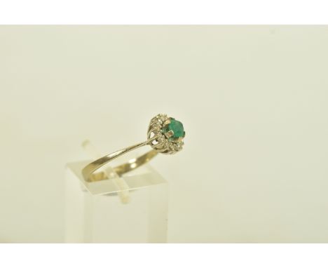A WHITE METAL CHRYSOPRASE AND DIAMOND CLUSTER RING, designed as a circular cut chrysoprase with single cut diamond cluster su