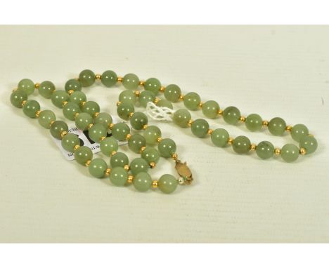 A JADE BEAD NECKLACE, comprising of fifty one spherical jade beads, with yellow metal spacers and metal hook clasp, stamped 9