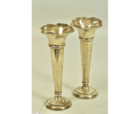 A PAIR OF EARLY 20TH CENTURY SILVER POSE VASES BY WALKER AND HALL, with tapering stem and undulating tops, maker's mark W&amp