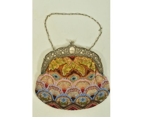 A LADIES LATE 19TH CENTURY GERMAN BEADED BAG, designed as a white metal foliate and fruit embossed hinged frame with coloured