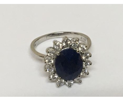 A Sapphire and diamond ring set with a central sapphire of 4.20 carat defused flanked by brilliant cut diamonds G/H colour ap