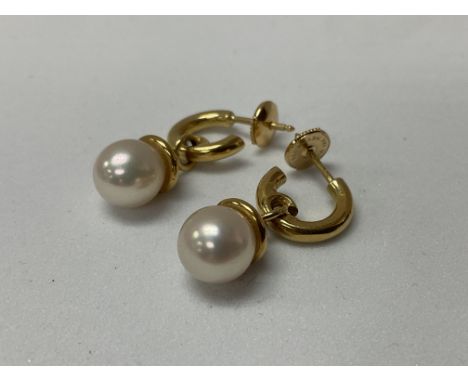 A matching pair of 18 ct Pearl and diamond drop earrings.