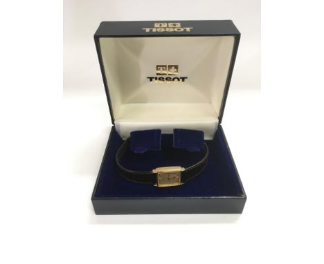 A boxed ladies Tissot watch.