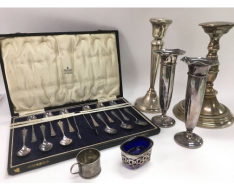 A cased set of silver teaspoons and tongs, Sheffield hallmarks, a silver candlestick, silver salts, an Elkington plate tazza 