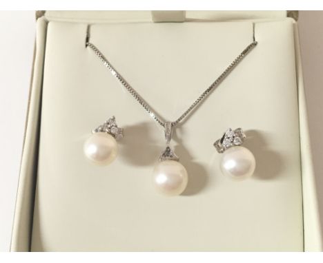 A pearl necklace and earring set. Chain is 9ct white gold.