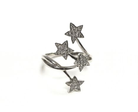 A 9ct white gold diamond ring, the diamonds set in four stars, approx .30ct, approx 5g and approx size R.