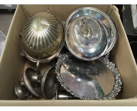 A collection of silver plated items comprising an engine turned oval entree dish, fruit basket, a pair of circular salvers et
