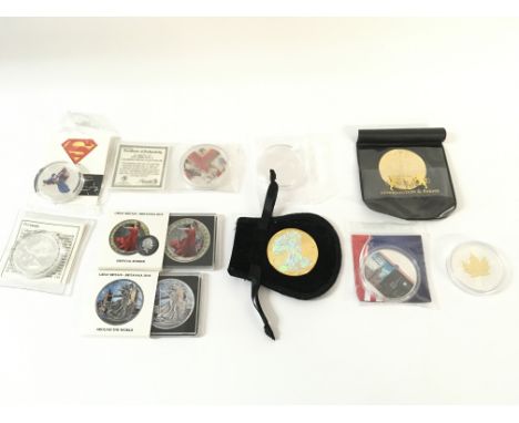 10 x various coins including coloured and antique finished Britannias and coloured pipe silver eagle.
