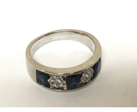 A Quality Natural Sapphire and patterns of alternating brilliant cut diamonds. Sold with IDRC report.. the natural sapphire a