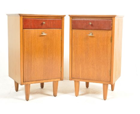 Harris Lebus - A pair of mid 20th Century British design oak bedside cabinets / table bedsides having square tops with single