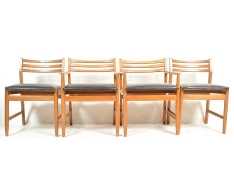 A set of four retro vintage 1960's Danish influence teak wood dining chairs / side chairs having shaped ladder backs with bla